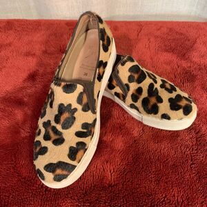 Leopard pony hair slip ons.
